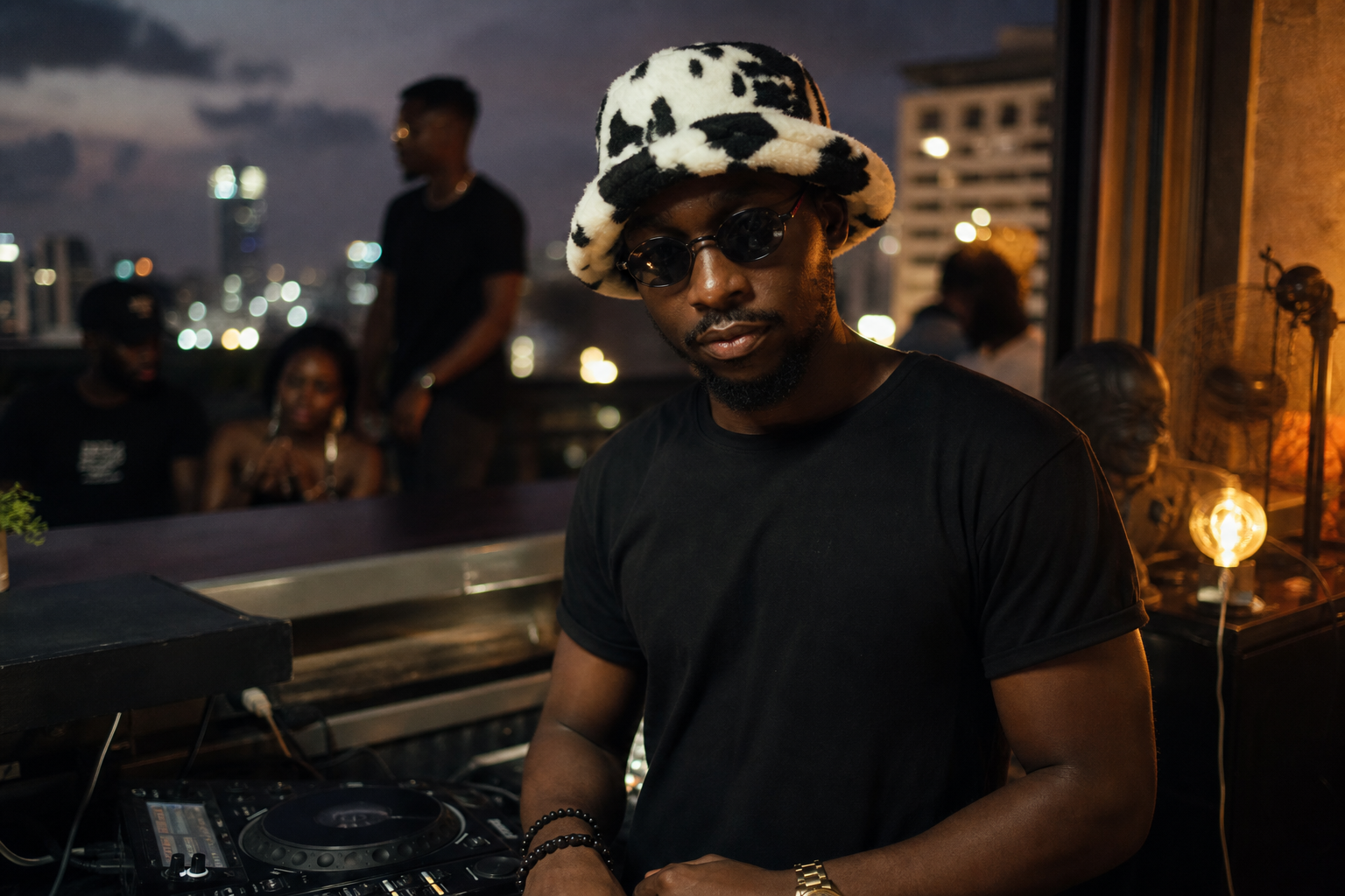 Jah-Jah in signature cow-print bucket hat and sunglasses